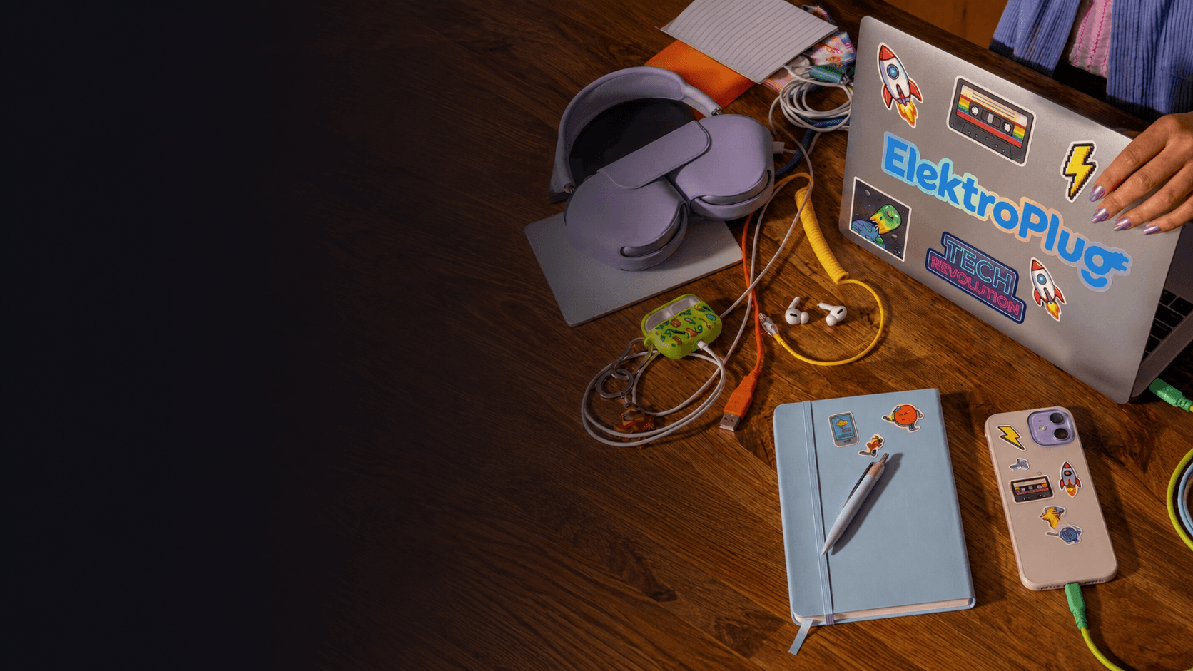 ElektroPlug-branded laptop and accessories laid out on a desk